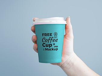 Paper Coffee Cup in Hand Mockup psd vector