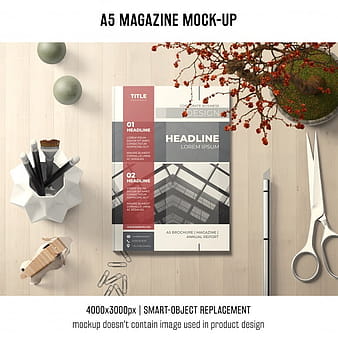 A5 magazine mockup with scissors psd vector