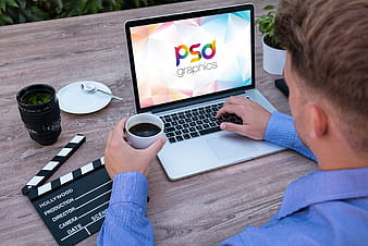 Man Working on Macbook Mockup PSD psd vector