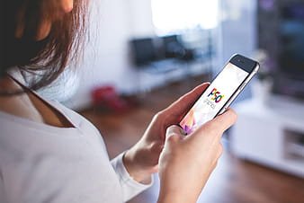 Holding iPhone in Hand Mockup PSD psd vector